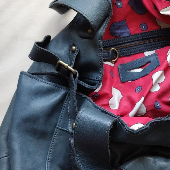 Anthropologie,Lucky Penny, leather purse with heart lining .